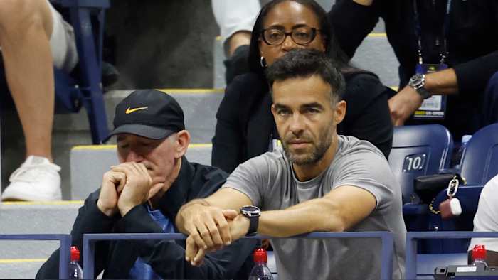 Brad Gilbert (L), coach for Coco Gauff reacts during U.S. Open.